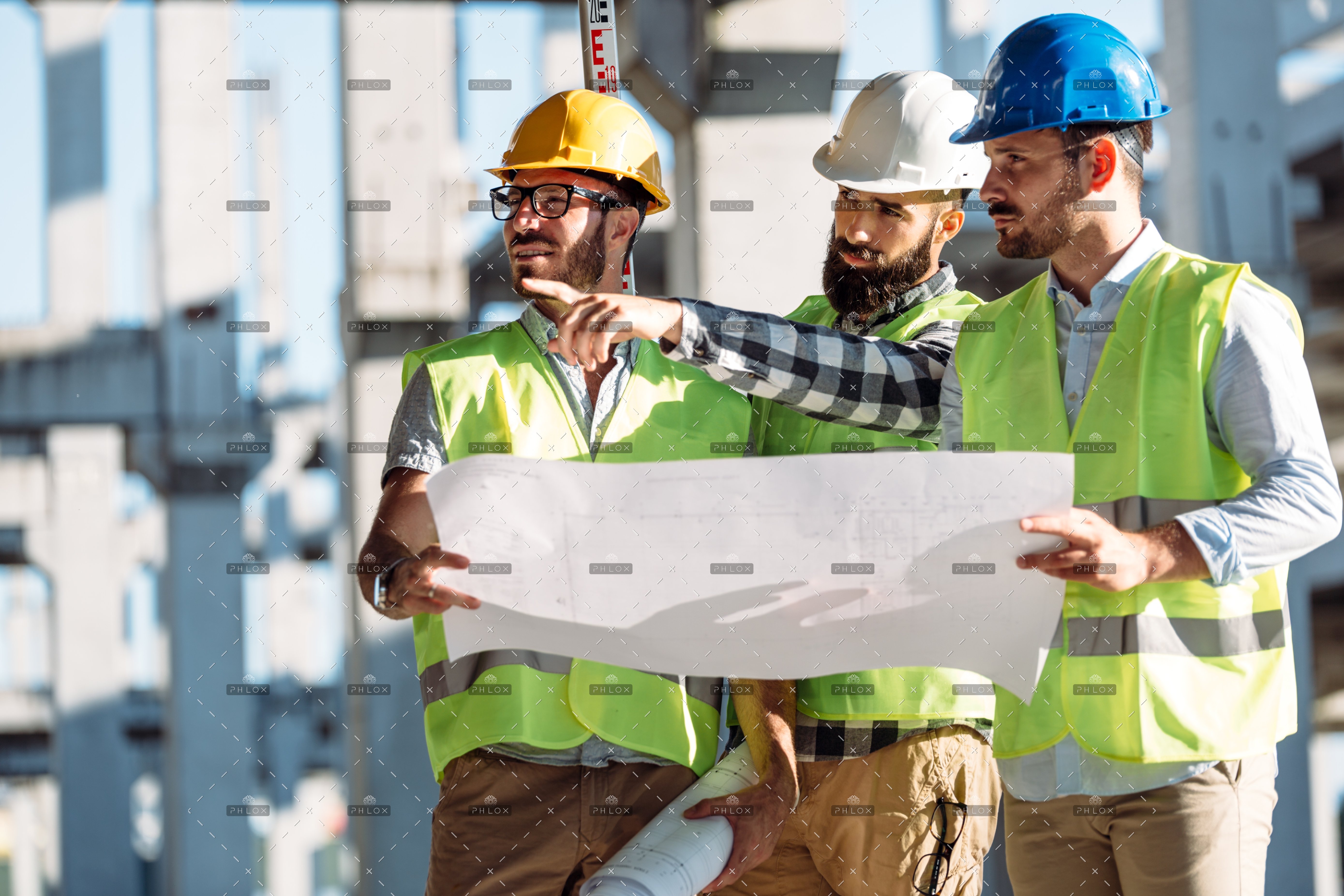 portrait-of-construction-engineers-working-on-J9KU7NC